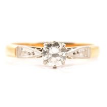 A diamond solitaire ring.