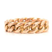 A 9 carat yellow gold curb link ring.