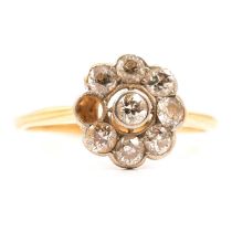 A diamond cluster ring.