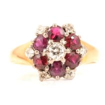 A ruby and diamond reverse cluster ring.