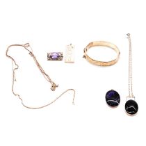 A silver ingot, Blue John pendant, amethyst brooch, silver bangle, black onyx pendant.