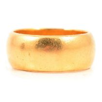 A 22 carat yellow gold wedding band.