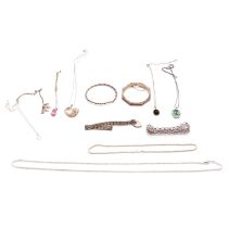 A collection of silver and white metal bracelets, pendants, chains and bangles.