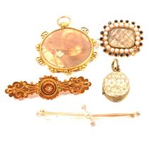 A collection of Victorian brooches and pendants.