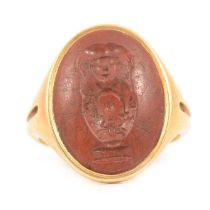 A signet ring with intaglio carved jasper.