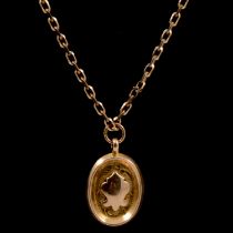 A 9 carat gold pendant and chain.