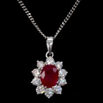 A ruby and diamond cluster pendant and chain.