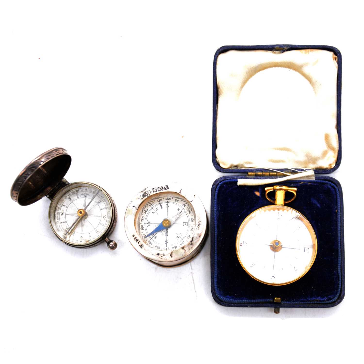 Georgian style gilt metal cased compass and two silver cased compass,