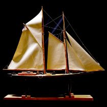Hand built wooden scale model pond yacht of a schooner,