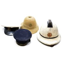 Various helmets and caps,