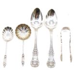 Two sets of silver teaspoons.
