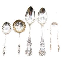 Two sets of silver teaspoons.