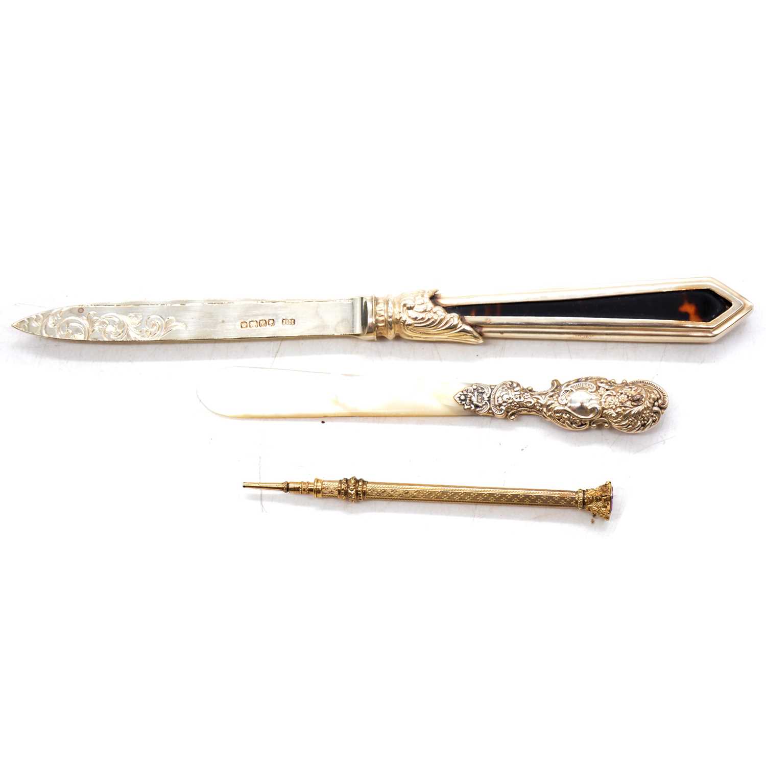 Victorian yellow metal propelling pencil and two silver mounted letter knives,