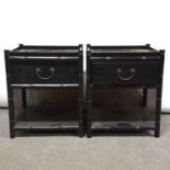 Pair of black painted and cane bedside cupboards.