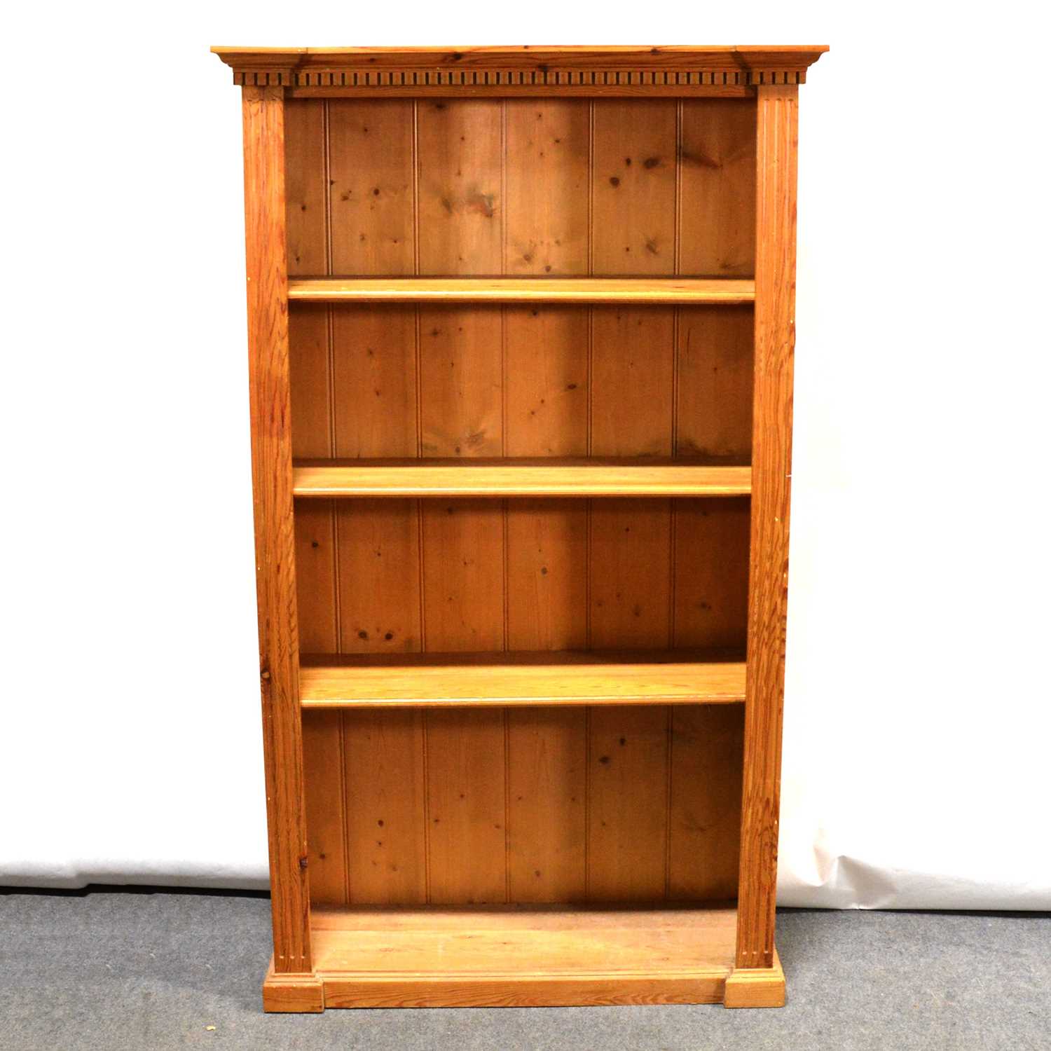 Three pine corner cupboards and an open bookcase