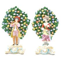 SALEROOM AMENDMENT - 20TH CENTURY REPRODUCTIONS OF A Pair of Chelsea Derby porcelain bocage figurine