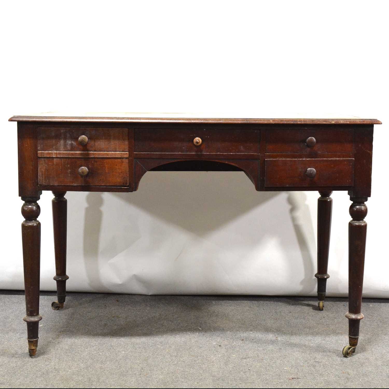 Victorian mahogany five-drawer writing table.