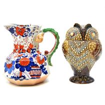 A Doulton Lambeth stoneware owl tobacco jar and cover, and a Mason's Hydra jug.