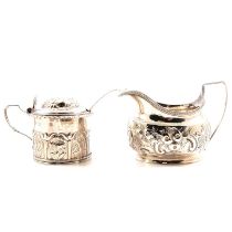 A Georgian silver cream jug and mustard pot.