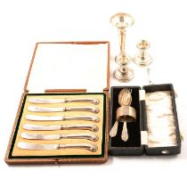 Set of silver pistol grip handled knives, Christening set, pair of candlesticks and a spill vase,