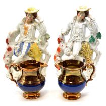 Two Staffordhisre flatback figures, and a pair of lustre jugs