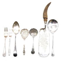 A mixed tray of silver-plated flatware.