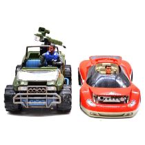 Two Action Man action figures with two cars and accessories