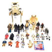 Twenty-five Star wars action figures, with Speeder bike and AT-ST
