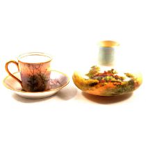 Royal Doulton cabinet cup and saucer and a Royal Worcester squat vase,