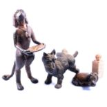 Collection of metal dog sculptures, and carved soapstone animals