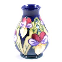 John Moorcroft for Moorcroft, a vase in the Heartsease design.