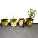 Four reconstituted stone garden planters,