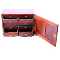 Victorian mahogany collectors’ cabinet, door enclosing ten drawers, containing a small collection of