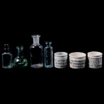 Collection of thirty medical ointment pots and glass miniature bottles