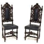 Pair of Victorian carved oak hall chairs,