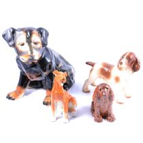 Salt-glazed model of a seated spaniel, and collection of other ceramic dog figurines