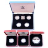 Seven silver proof coins.