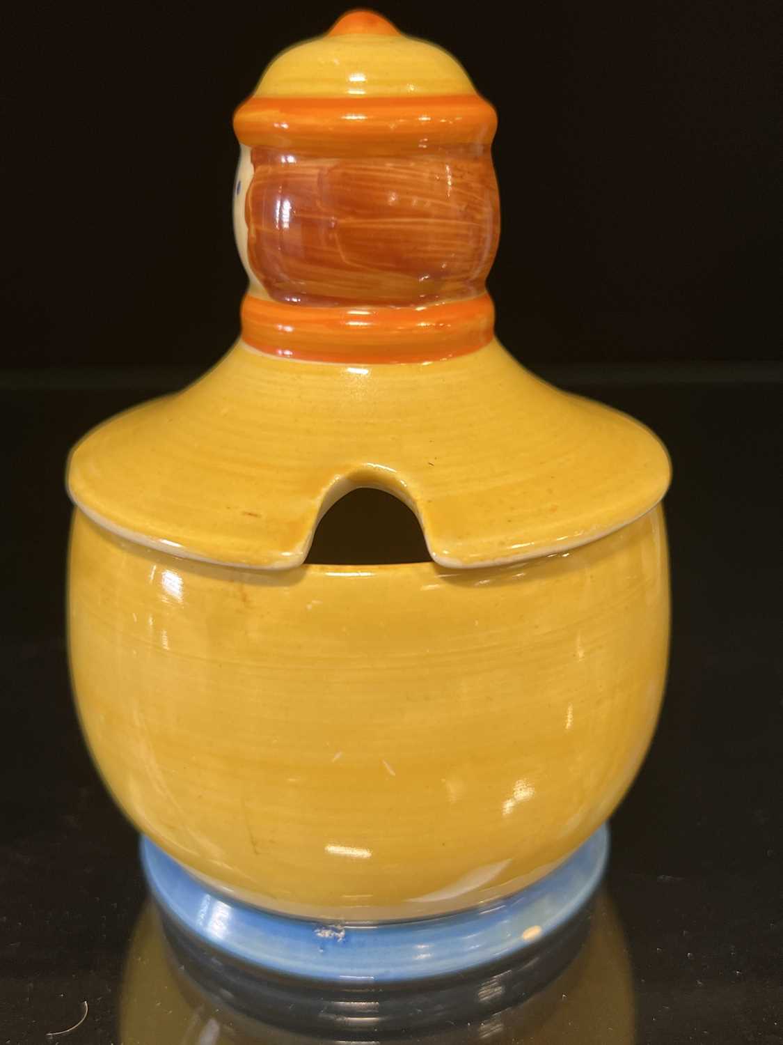 Clarice Cliff, a novelty ‘Dutch Boy’ preserve pot and cover, - Image 3 of 8