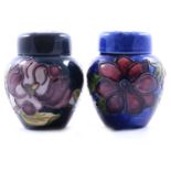 Two small Moorcroft Pottery ginger jars and covers