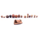 Five coquilla nut pomanders, other carved nut objects,
