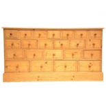 Large bank of pine drawers,