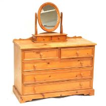 Modern pine chest of drawers and a dressing table mirror,