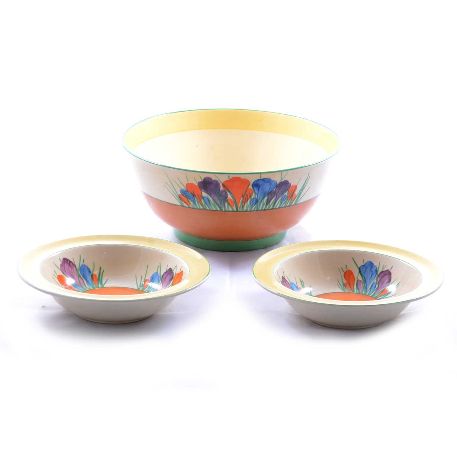 Clarice Cliff, a large 'Crocus' pattern fruit bowl and two smaller bowls