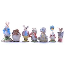 Twelve Beatrix Potter figures.