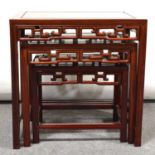 Nest of three Chinese hardwood tables, mother of pearl inlaid, and a barrel seat,