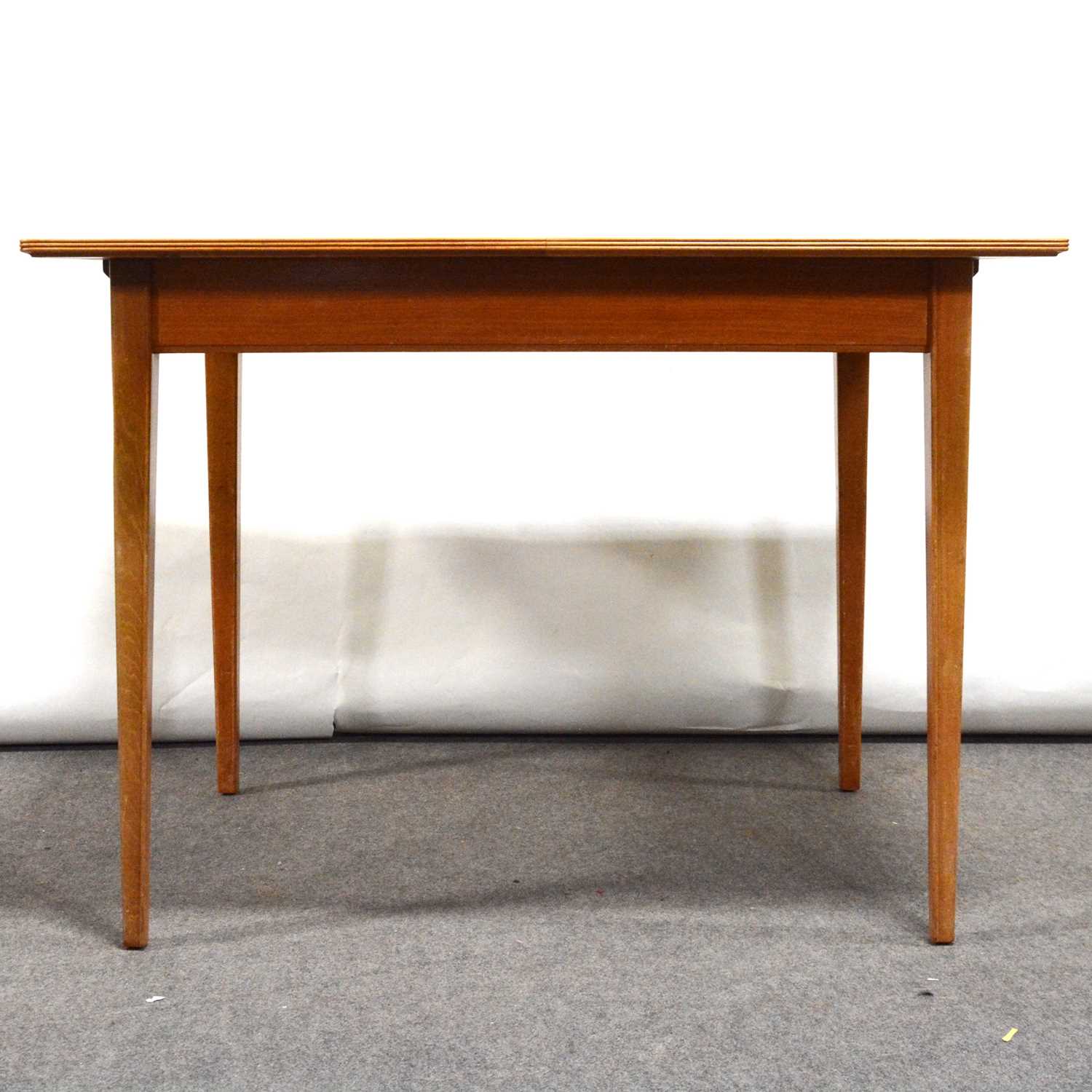 Mid-century flame veneer extending dining table, possibly Gordon Russell