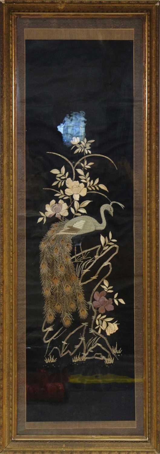 Large embroidered silk panel of a peacock on floral branches, black ground