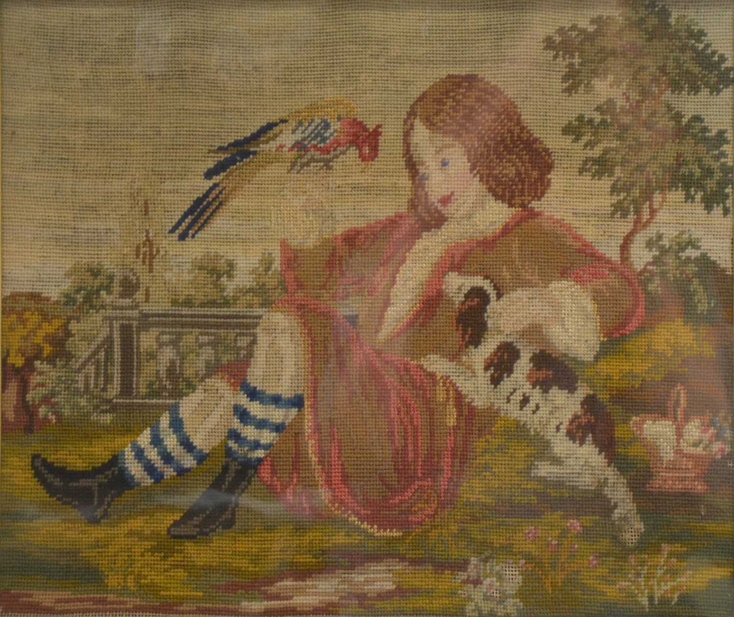 Georgian needlework panel of a boy in a garden with a spaniel and bird