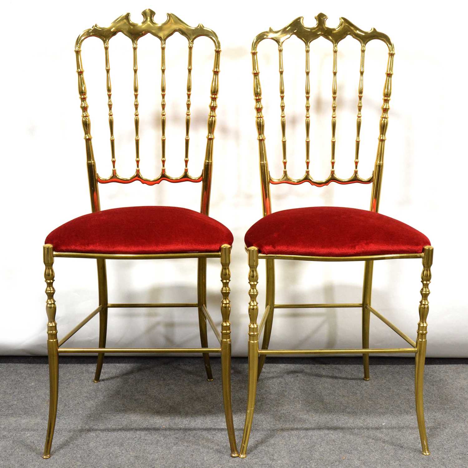 Pair of brass salon chairs,