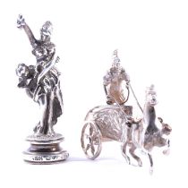 Cast silver figural seal, and a small silver model of a charioteer